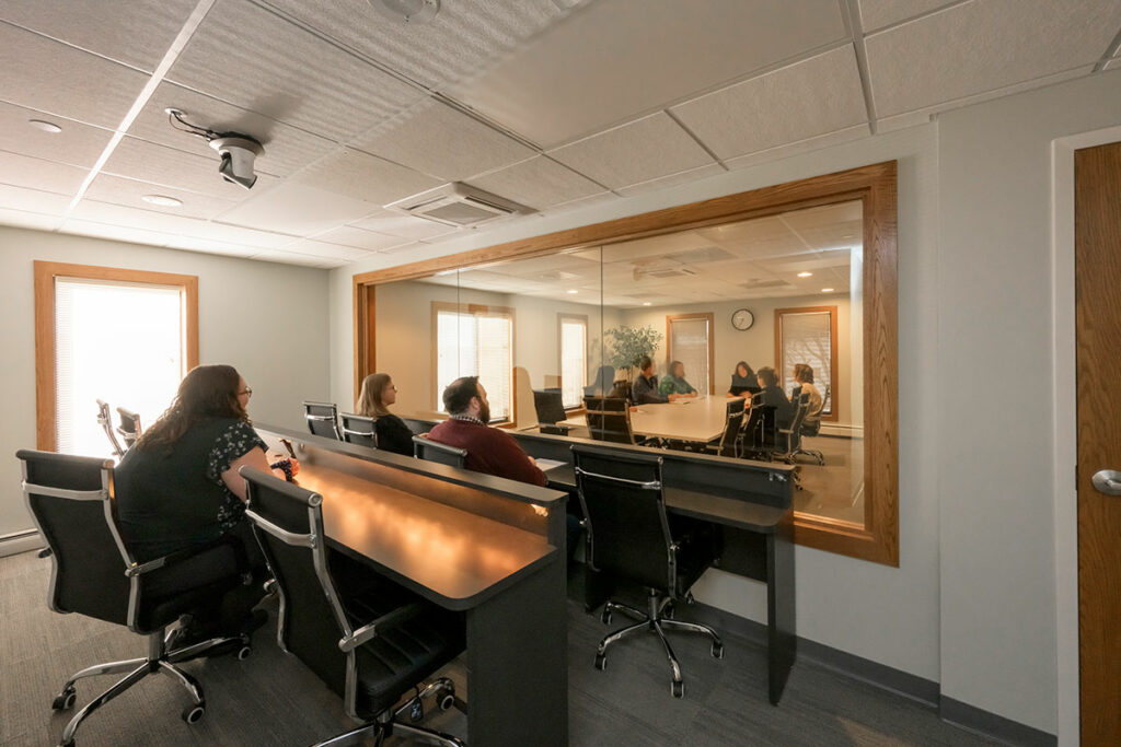 Private observation room in Horizon Group focus group facility with view of 12-person conference room.